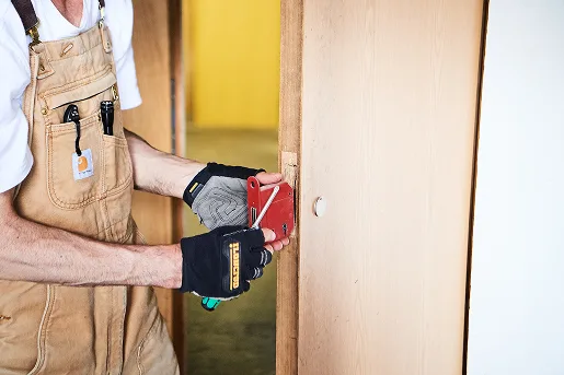 RN Locksmith working at a property