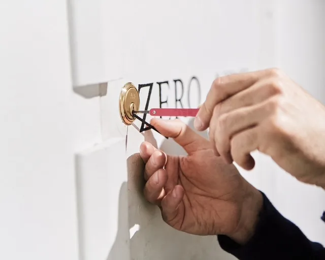 Locksmith completing a door lock repair